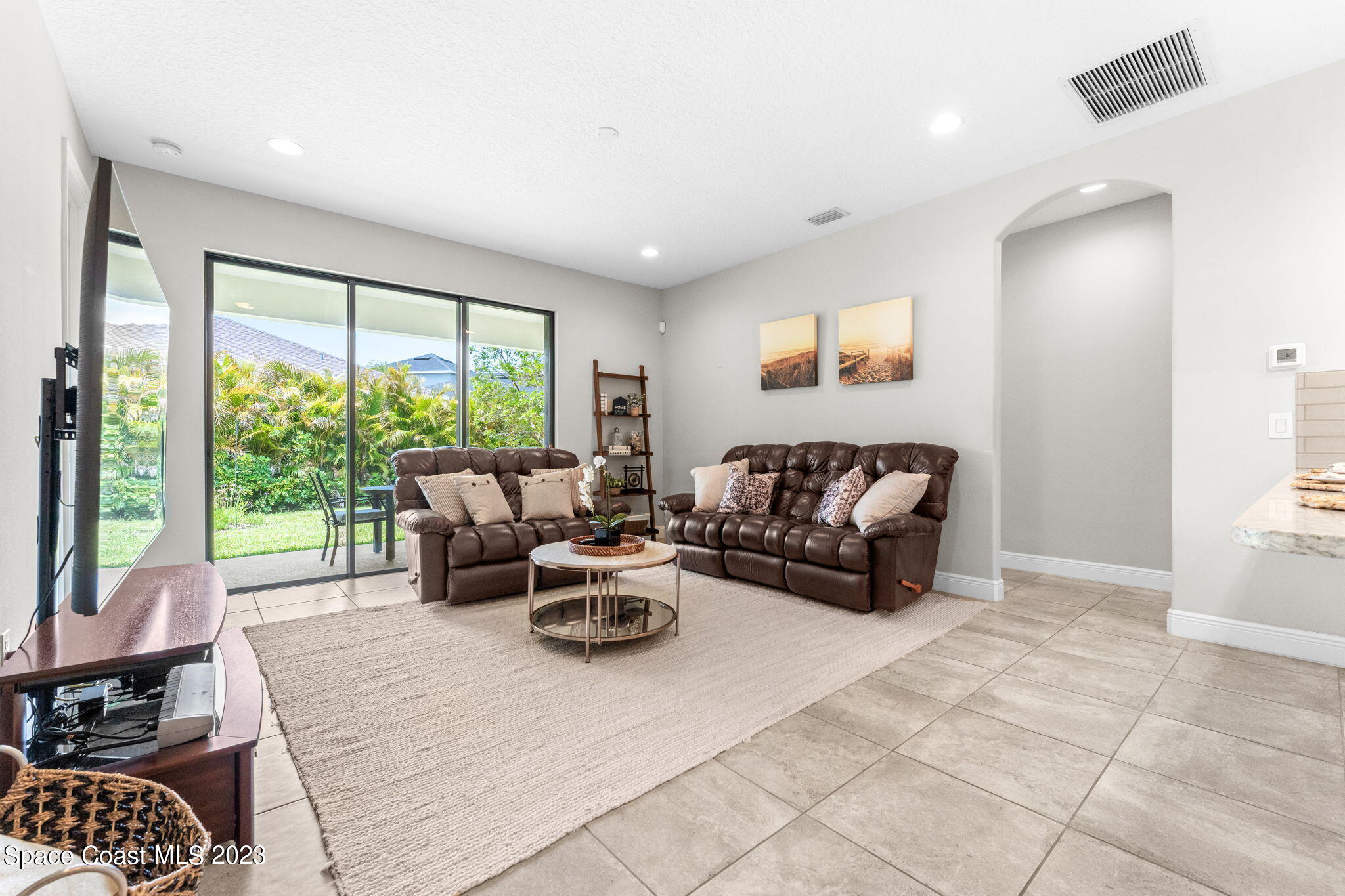 3640 Stabane Place Melbourne, FL 32940 - Photo 45 of 85 a living room with furniture and a large window