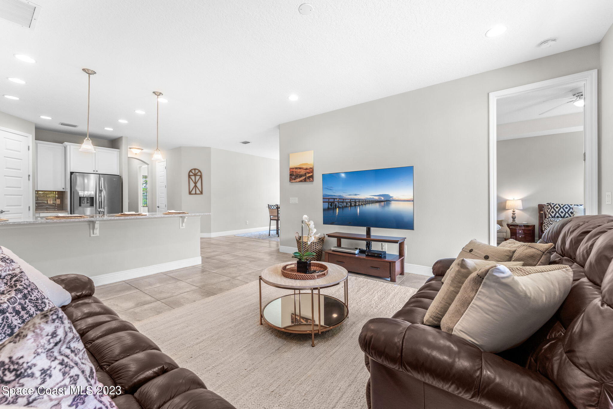 3640 Stabane Place Melbourne, FL 32940 - Photo 46 of 85 a living room with furniture and a flat screen tv