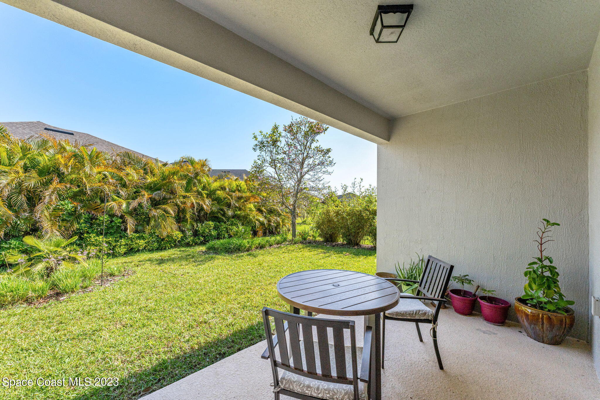 3640 Stabane Place Melbourne, FL 32940 - Photo 50 of 85 a view of a porch with furniture and a yard