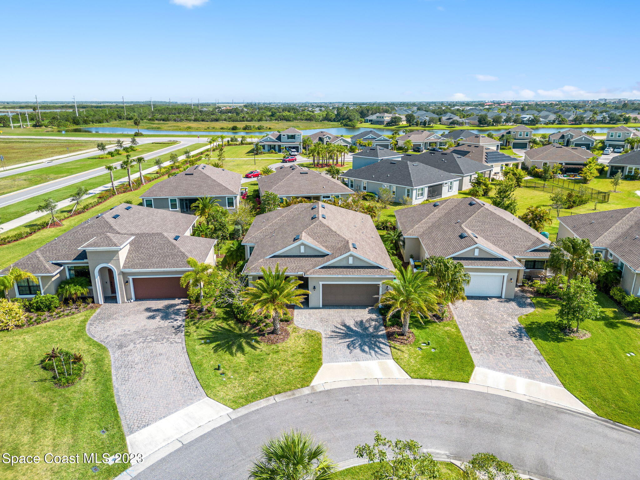3640 Stabane Place Melbourne, FL 32940 - Photo 63 of 85 a view of a city with lawn chairs and large trees