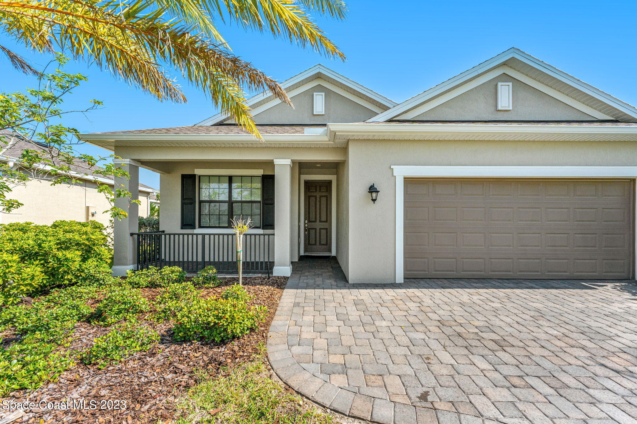 3640 Stabane Place Melbourne, FL 32940 - Photo 7 of 85 a front view of a house with garden