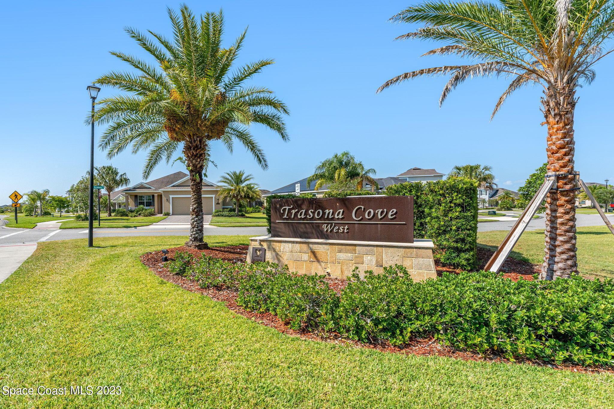 3640 Stabane Place Melbourne, FL 32940 - Photo 74 of 85 a view of swimming pool with a garden and palm trees