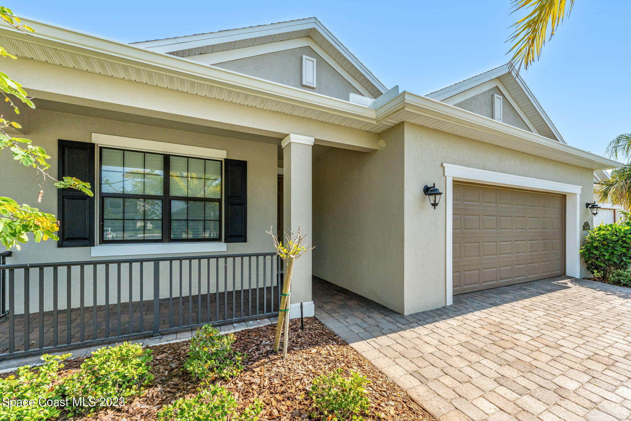 3640 Stabane Place Melbourne, FL 32940 - Photo 8 of 85 a view of a house with a small yard and wooden floor and fence