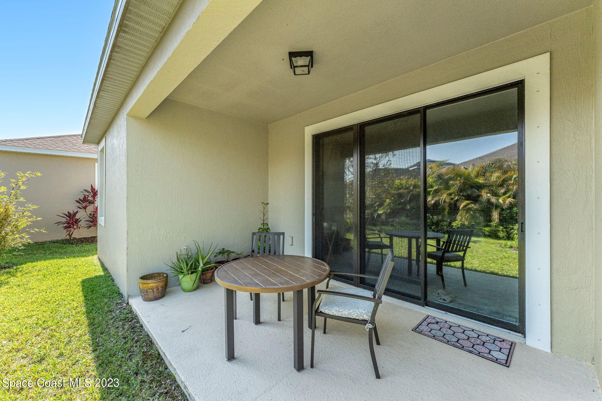 3640 Stabane Place Melbourne, FL 32940 - Photo 10 of 85 a room with furniture and a floor to ceiling window