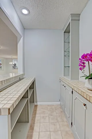 an empty room with large windows