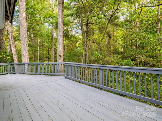 a view of a balcony with wooden floor