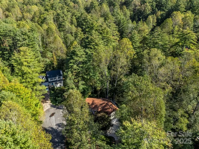 a aerial view of a house with a yard