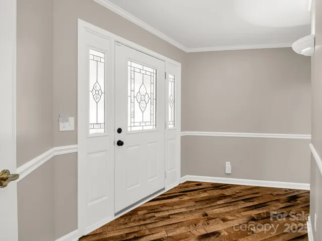 a view of room with window and hardwood floor