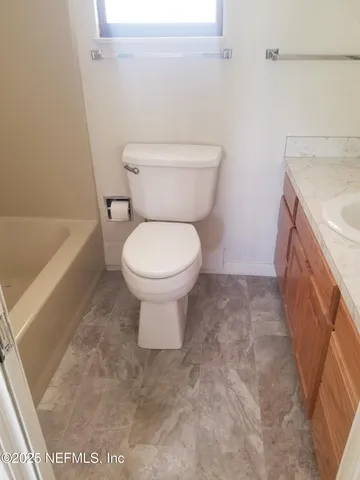 a bathroom with a sink and a toilet