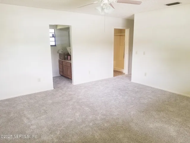 an empty room with a bathroom