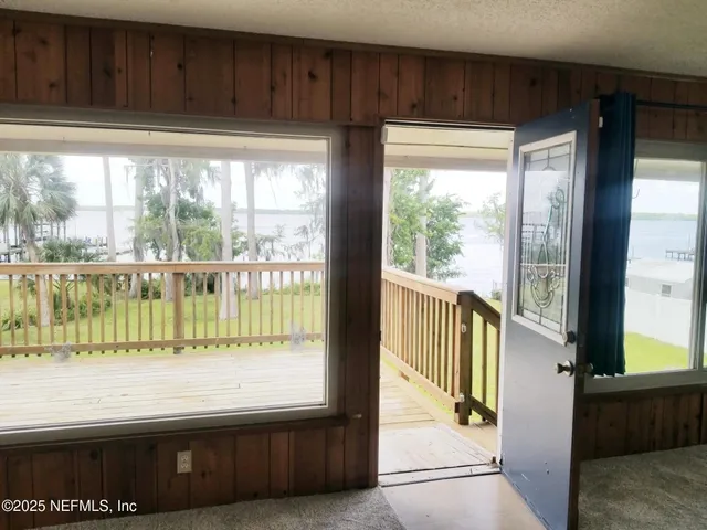a kitchen with a large window and a kitchen view
