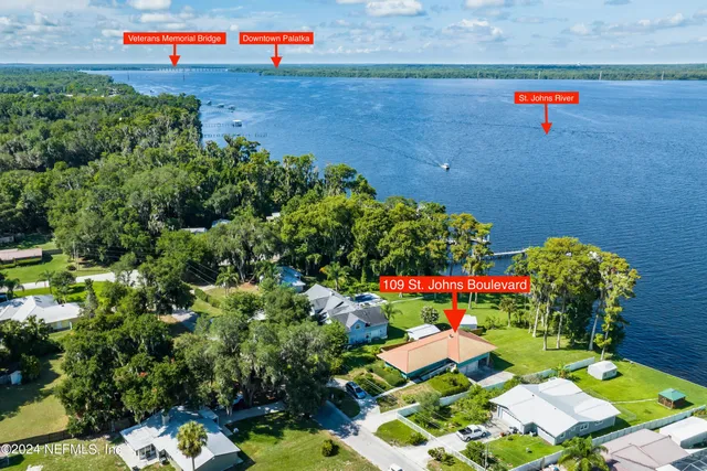 a view of a lake with a house