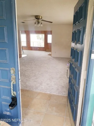 a view of empty room with windows