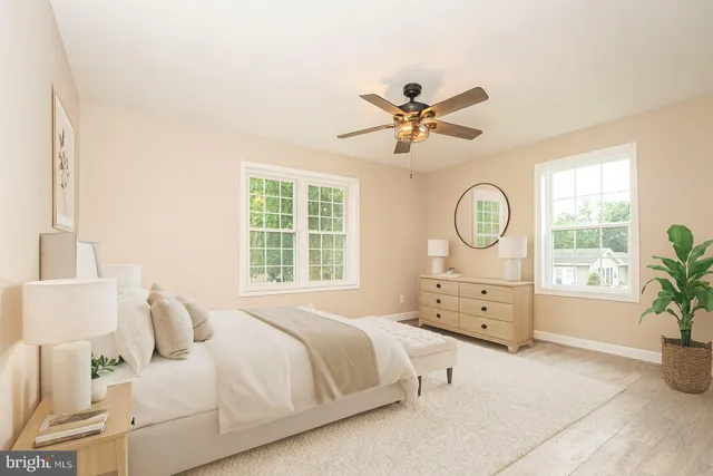 a bedroom with a large bed and a window