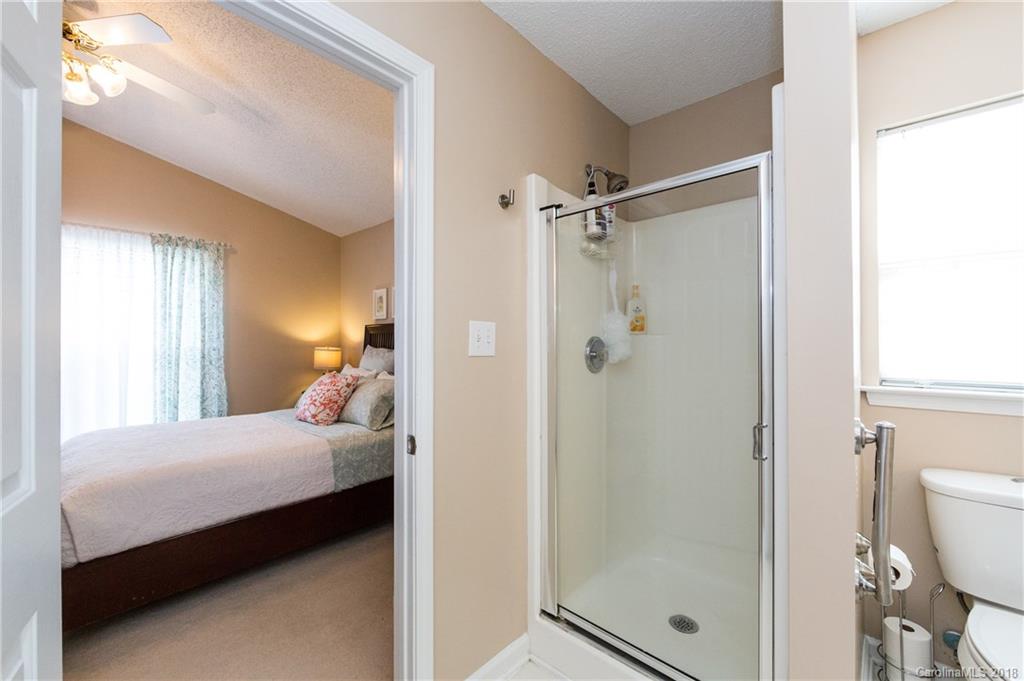 236 Grayland Road Mooresville, NC 28115 - Photo 18 of 27 a bedroom with a bed and a shower