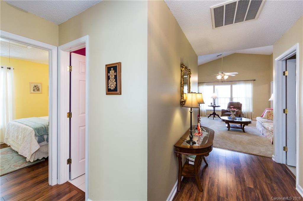 236 Grayland Road Mooresville, NC 28115 - Photo 3 of 27 a view of a hallway with livingroom and furniture