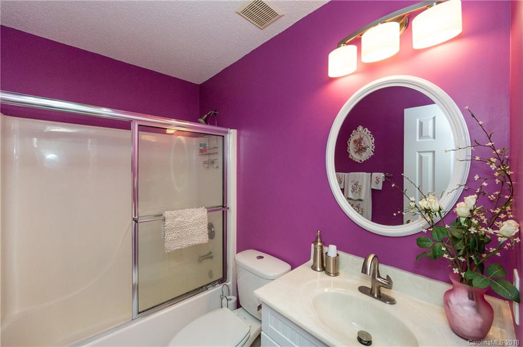 236 Grayland Road Mooresville, NC 28115 - Photo 21 of 27 a bathroom with a sink mirror vanity and toilet