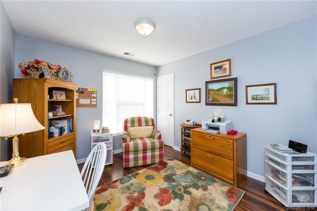 236 Grayland Road Mooresville, NC 28115 - Photo 22 of 27 a room with furniture a rug and a window