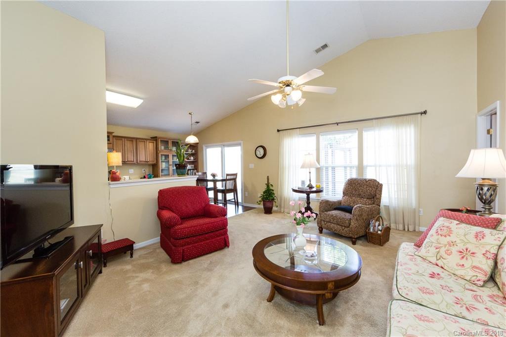 236 Grayland Road Mooresville, NC 28115 - Photo 4 of 27 a living room with furniture a window and a flat screen tv