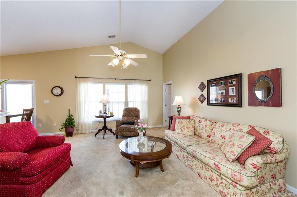 236 Grayland Road Mooresville, NC 28115 - Photo 5 of 27 a living room with furniture and a large window