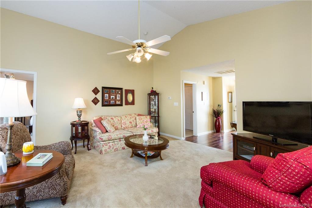 236 Grayland Road Mooresville, NC 28115 - Photo 6 of 27 a living room with furniture and a flat screen tv