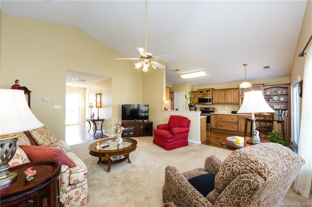 236 Grayland Road Mooresville, NC 28115 - Photo 7 of 27 a bedroom with furniture and a chandelier