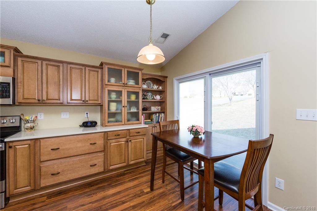 236 Grayland Road Mooresville, NC 28115 - Photo 8 of 27 a view of a dining room with furniture window and wooden floor