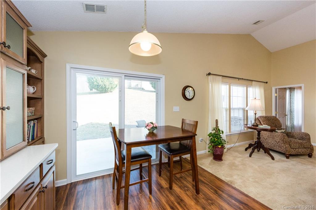 236 Grayland Road Mooresville, NC 28115 - Photo 9 of 27 a view of a dining room with furniture window and wooden floor
