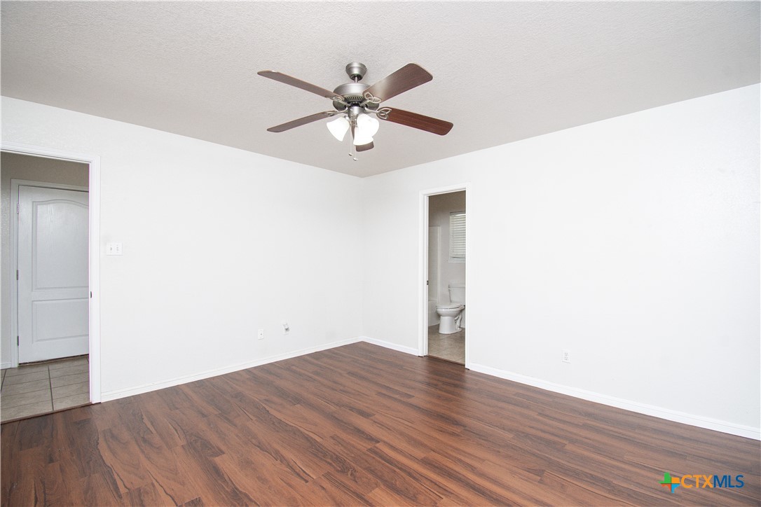 568 Morgan's Point Road Belton, TX 76513 - Photo 11 of 20 a view of a room with wooden floor and closet