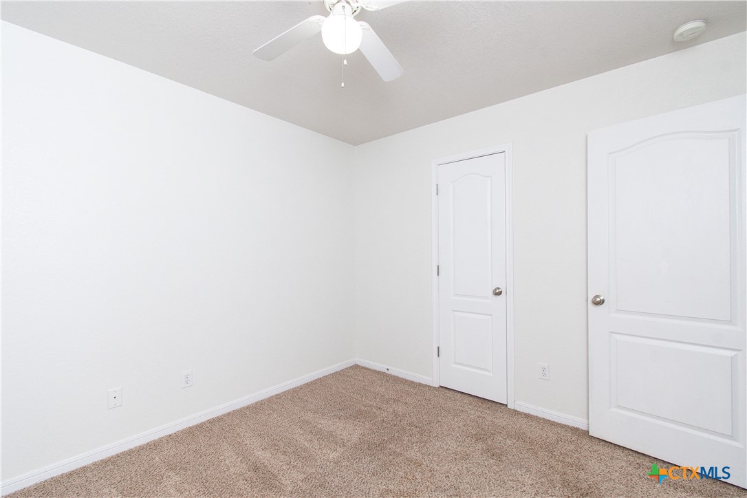 568 Morgan's Point Road Belton, TX 76513 - Photo 19 of 20 an empty room with a ceiling fan