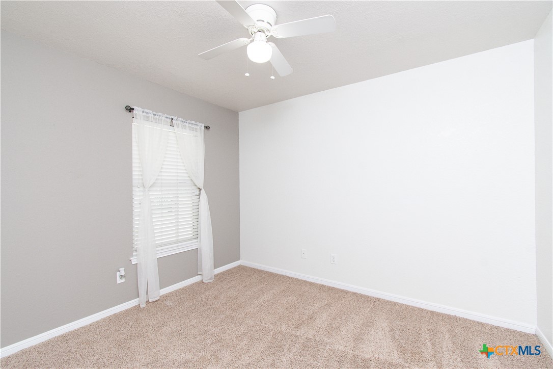 568 Morgan's Point Road Belton, TX 76513 - Photo 20 of 20 an empty room with windows and fan