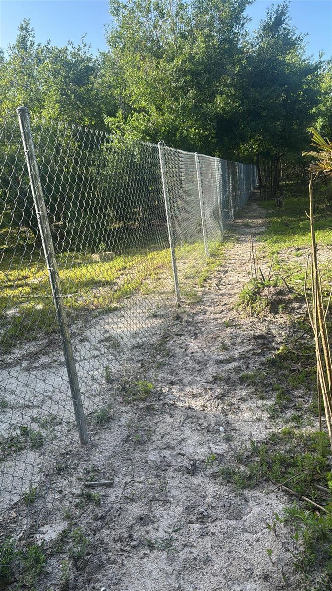 19773 Northwest 272nd Street Okeechobee, FL 34972 - Photo 3 of 13 a view of a yard with a slide