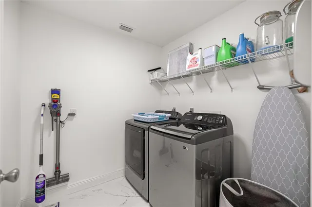 a kitchen with appliances cabinets and a stove top oven
