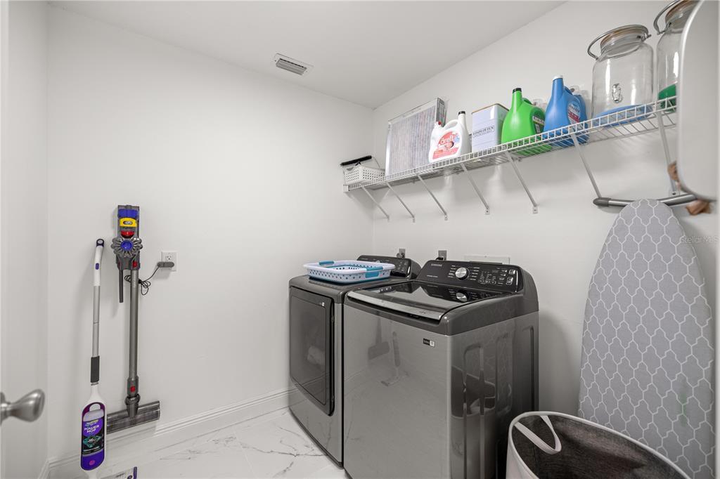 7191 Hemlock Road Ocala, FL 34472 - Photo 13 of 34 a kitchen with appliances cabinets and a stove top oven