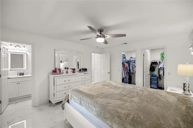 a room with a bed and a chandelier