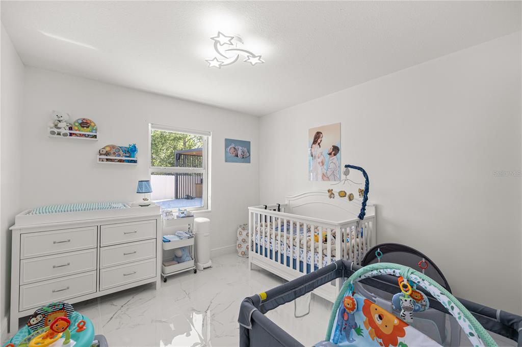 7191 Hemlock Road Ocala, FL 34472 - Photo 21 of 34 a bedroom with furniture and a window