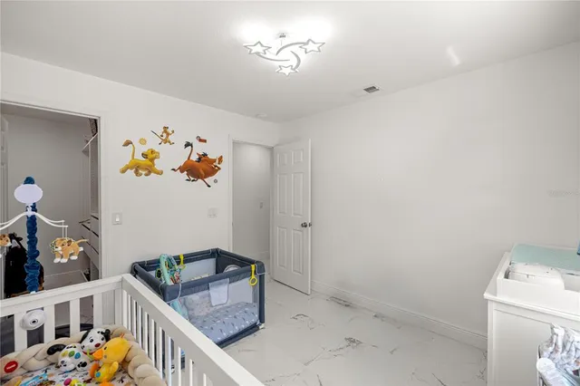 a storage room with furniture and baby crib