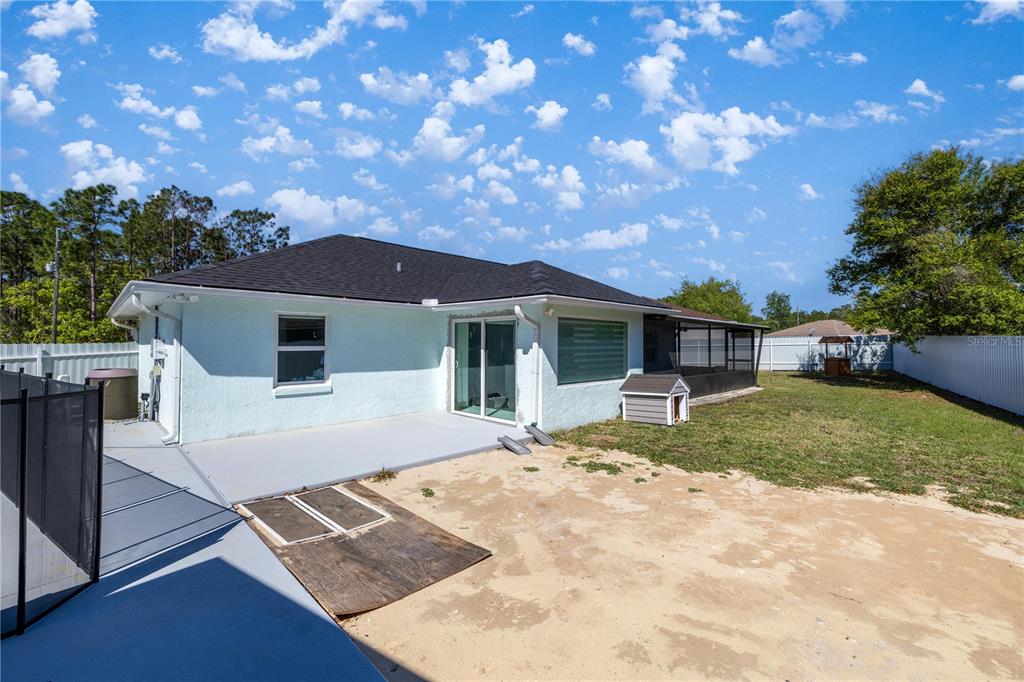 7191 Hemlock Road Ocala, FL 34472 - Photo 28 of 34 a front view of a house with a yard