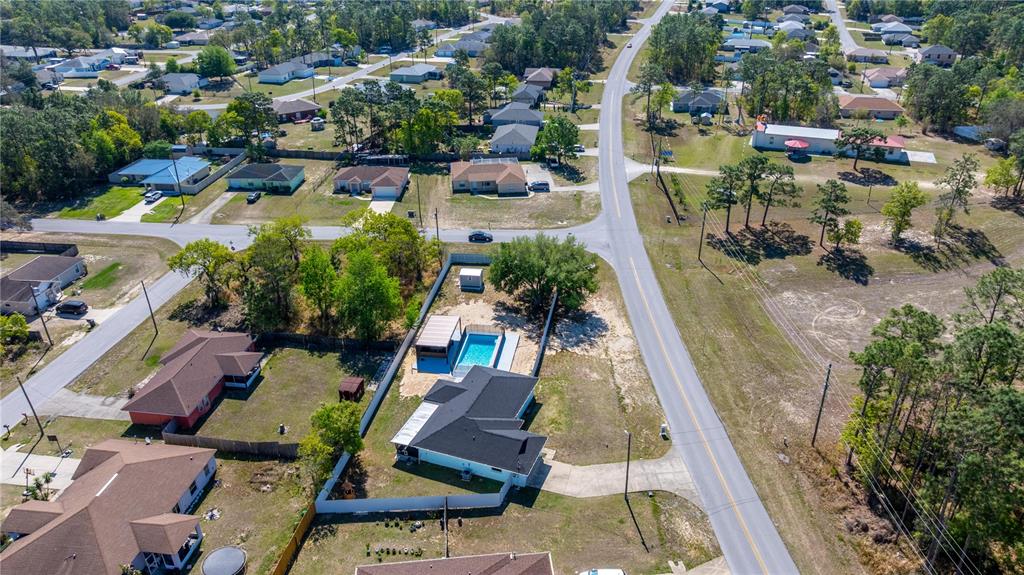 7191 Hemlock Road Ocala, FL 34472 - Photo 4 of 34 an aerial view of a house with a swimming pool yard and outdoor seating