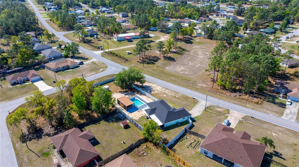7191 Hemlock Road Ocala, FL 34472 - Photo 5 of 34 an aerial view of a swimming pool with outdoor seating