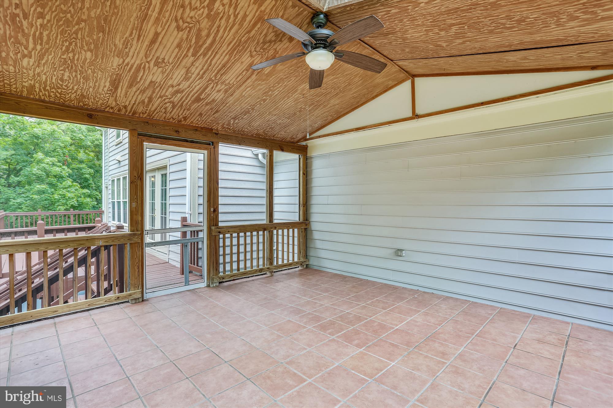 8908 Spring Berry Court Gaithersburg, MD 20886 - Photo 20 of 59 Screen Porch next to stairs to the fenced yard