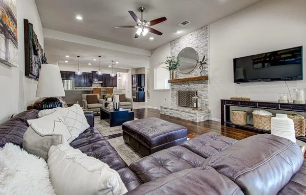 a living room with furniture and a fireplace