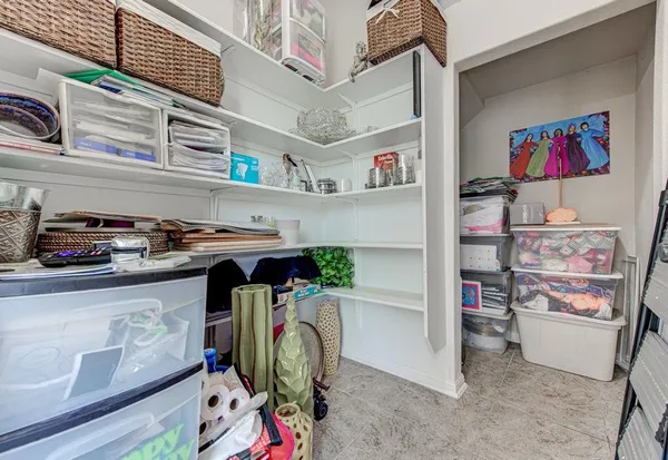 a utility room with fridge dryer and washer