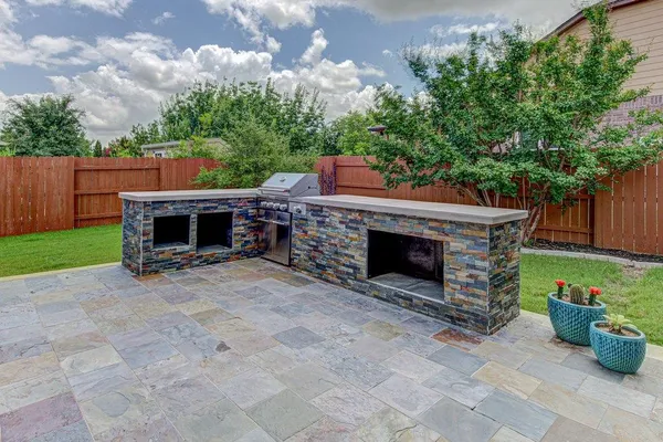 a view of a house with a tub and chairs