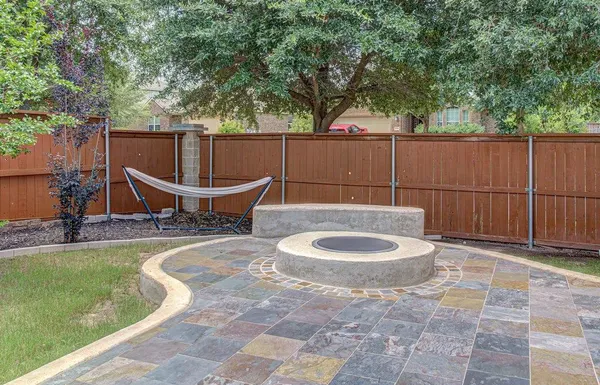 a outdoor space with a couch and chairs