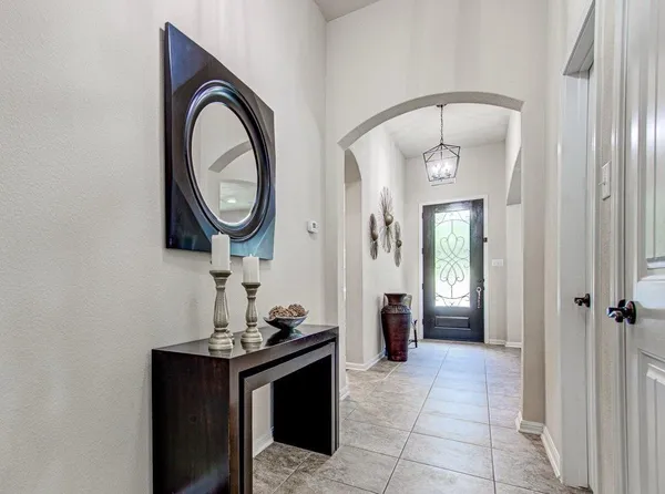 a room that has a mirror and a wooden floor