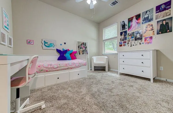 a bed room with a bed and a dresser