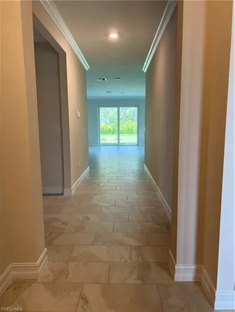 a view of hallway with windows