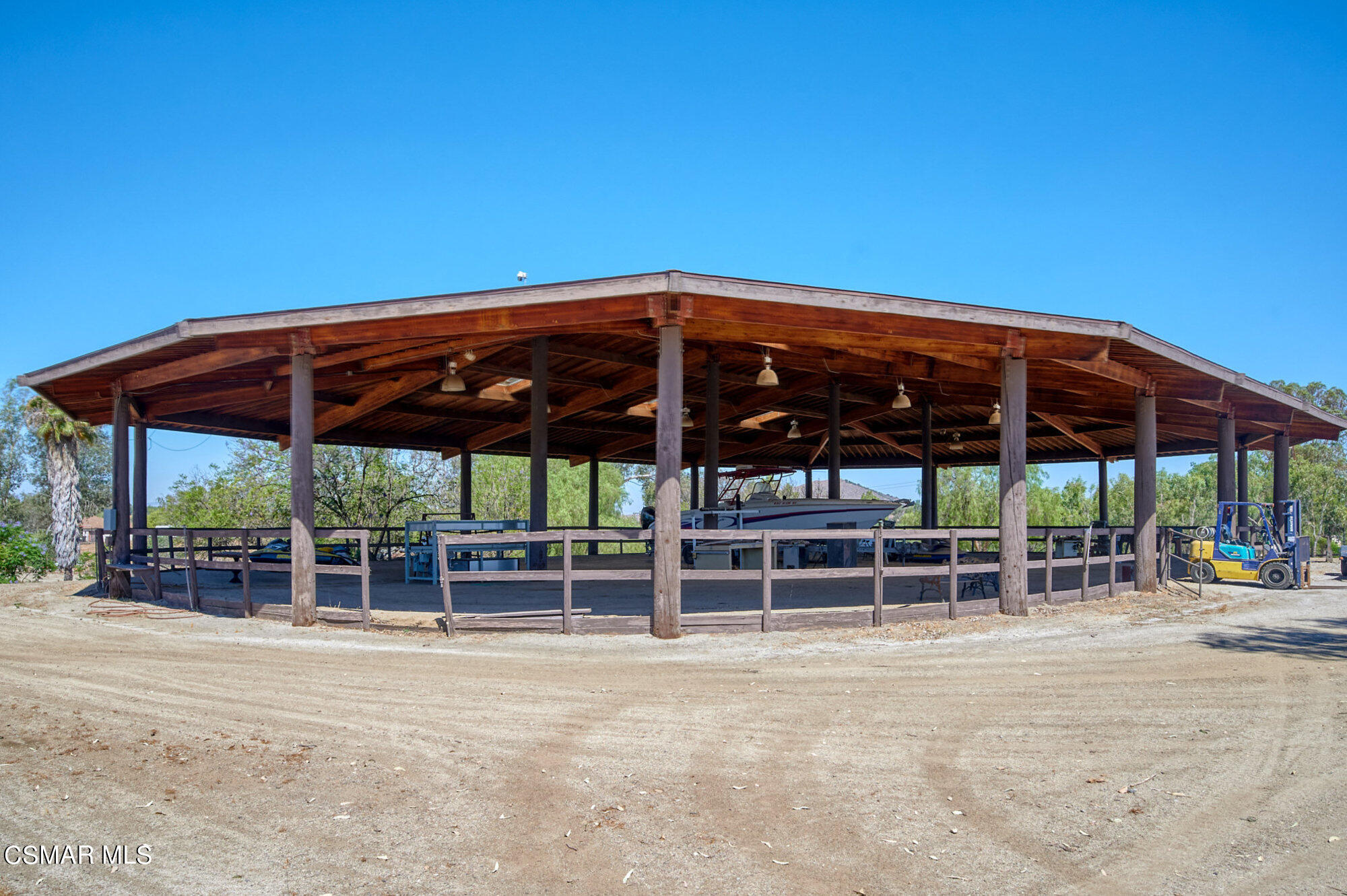 17498 Santa Rosa Mine Road Perris, CA 92570 - Photo 16 of 55 a view of a chairs and table under an umbrella