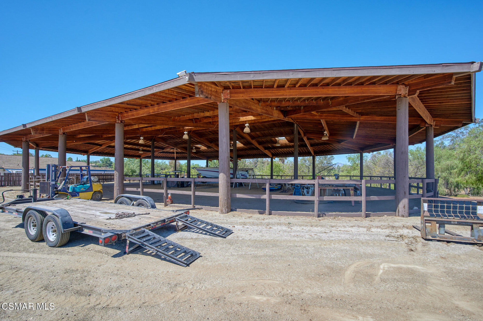 17498 Santa Rosa Mine Road Perris, CA 92570 - Photo 18 of 55 a view of a patio with a table and chairs under an umbrella